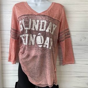 Women’s football tee shirt.